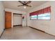 Bedroom with mirrored closet doors and window at 114 Connie Ave, Tampa, FL 33613