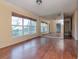 Spacious living room featuring hardwood floors and large windows at 114 Connie Ave, Tampa, FL 33613