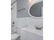 Clean bathroom, white vanity, and subway tile at 1202 S Walker St, Plant City, FL 33563