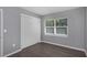 Bright bedroom, grey walls, and wood-look floors at 1202 S Walker St, Plant City, FL 33563