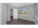 Bright bedroom with gray walls, wood-look floors, and window at 1202 S Walker St, Plant City, FL 33563