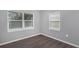 Spacious bedroom with grey walls and wood-look floors at 1202 S Walker St, Plant City, FL 33563