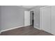 Simple bedroom with grey walls and wood-look floors at 1202 S Walker St, Plant City, FL 33563