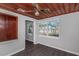 Bright bonus room features wood ceiling, gray walls, and dark laminate flooring at 1202 S Walker St, Plant City, FL 33563
