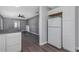 Open concept kitchen with white cabinets and view to living room at 1202 S Walker St, Plant City, FL 33563