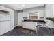 Modern kitchen featuring white cabinets and dark countertops at 1202 S Walker St, Plant City, FL 33563