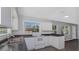Updated kitchen with white cabinets and dark countertops at 1202 S Walker St, Plant City, FL 33563