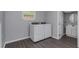 Laundry room with washer, dryer, and adjacent bathroom at 1202 S Walker St, Plant City, FL 33563