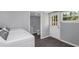 Laundry room with washer, dryer, and exterior access at 1202 S Walker St, Plant City, FL 33563