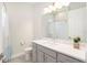Bright bathroom with single vanity, shower/tub combo, and gray cabinets at 12425 Glenridge Ln, Parrish, FL 34219