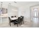 Bright dining room features a marble table and black leather chairs at 12425 Glenridge Ln, Parrish, FL 34219