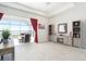 Living area features a fireplace, built-in shelving, and access to the lanai at 12425 Glenridge Ln, Parrish, FL 34219