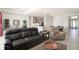 Open concept living room with comfortable seating and a view of the kitchen at 12425 Glenridge Ln, Parrish, FL 34219