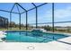 Inviting screened pool with waterfall feature at 12425 Glenridge Ln, Parrish, FL 34219