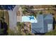 Aerial view of a teal home with a light blue driveway at 1316 Paddock Ct, Tarpon Springs, FL 34689