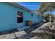 House exterior showcasing light teal paint and a side yard at 1316 Paddock Ct, Tarpon Springs, FL 34689