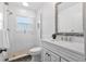 Updated bathroom with white vanity, walk-in shower, and patterned floor tiles at 1330 Snell Isle Ne Blvd # 4, St Petersburg, FL 33704