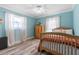 Charming bedroom with light blue walls, wooden bed, and plenty of natural light at 1330 Snell Isle Ne Blvd # 4, St Petersburg, FL 33704
