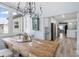 Open concept dining room with rustic wooden table and kitchen view at 1330 Snell Isle Ne Blvd # 4, St Petersburg, FL 33704