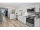 Modern kitchen with white cabinets, granite countertops and stainless steel appliances at 1330 Snell Isle Ne Blvd # 4, St Petersburg, FL 33704