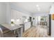 Modern kitchen with white cabinets, granite countertops, and stainless steel appliances at 1330 Snell Isle Ne Blvd # 4, St Petersburg, FL 33704