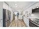 Modern kitchen with white cabinets, granite countertops and stainless steel appliances at 1330 Snell Isle Ne Blvd # 4, St Petersburg, FL 33704