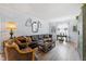 Bright living room with a comfortable leather sofa and large windows at 1330 Snell Isle Ne Blvd # 4, St Petersburg, FL 33704