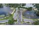 Aerial view of community near lake with parking at 13760 Orange Sunset Dr # 201, Tampa, FL 33618