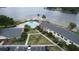 Aerial view of community pool and lakefront at 13760 Orange Sunset Dr # 201, Tampa, FL 33618