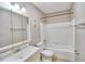 Clean bathroom with a tub, toilet, and vanity at 13760 Orange Sunset Dr # 201, Tampa, FL 33618