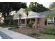 Brick building with columns and landscaping at 13760 Orange Sunset Dr # 201, Tampa, FL 33618