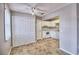 White kitchen with white cabinets, tiled floor and appliances at 13760 Orange Sunset Dr # 201, Tampa, FL 33618