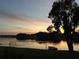 Tranquil sunrise view over lake at 13760 Orange Sunset Dr # 201, Tampa, FL 33618