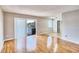 Living room with light wood floors, sliding glass doors to balcony, and view of water at 13760 Orange Sunset Dr # 201, Tampa, FL 33618