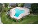 Inviting community pool with surrounding lounge chairs at 13760 Orange Sunset Dr # 201, Tampa, FL 33618