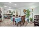 Bright dining room with a table for four and mirrored wall at 14022 Passage Way, Seminole, FL 33776