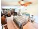 Bedroom with brass bed frame, built in shelving and carpeted floors at 1410 Bass Blvd, Dunedin, FL 34698