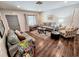 Cozy living room with hardwood floors, comfy seating, and a modern coffee table at 1410 Bass Blvd, Dunedin, FL 34698