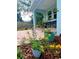 Landscaped backyard with potted plants and a patio at 1518 E North St, Tampa, FL 33610