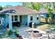 Charming backyard with patio, fire pit, and grilling area at 1518 E North St, Tampa, FL 33610