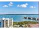 Breathtaking view of the ocean, with a large condo building and tennis courts at 1520 Gulf Blvd # 1602, Clearwater Beach, FL 33767