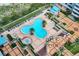 Aerial shot showcases the community pool area with sun loungers and patio at 1520 Gulf Blvd # 1602, Clearwater Beach, FL 33767