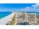 Aerial shot of the oceanfront condo building and the pristine beach at 1520 Gulf Blvd # 1602, Clearwater Beach, FL 33767
