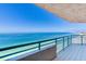 Beautiful condo balcony overlooking a tranquil ocean on a clear day at 1520 Gulf Blvd # 1602, Clearwater Beach, FL 33767