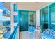 Beautiful condo balcony with ocean views, seating, and a glimpse into the serene bedroom at 1520 Gulf Blvd # 1602, Clearwater Beach, FL 33767