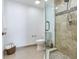 Bathroom featuring a glass shower, toilet, and a decorative towel basket at 1520 Gulf Blvd # 1602, Clearwater Beach, FL 33767