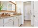 Bright bathroom featuring a granite countertop and an open doorway to the toilet at 1520 Gulf Blvd # 1602, Clearwater Beach, FL 33767