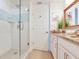Bright bathroom with a granite countertop, walk-in shower and door to the toilet at 1520 Gulf Blvd # 1602, Clearwater Beach, FL 33767
