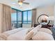 Cozy bedroom with ocean view, soft linens, and modern furnishings at 1520 Gulf Blvd # 1602, Clearwater Beach, FL 33767