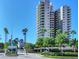 Elegant condominium with manicured landscaping and a gatehouse entrance at 1520 Gulf Blvd # 1602, Clearwater Beach, FL 33767